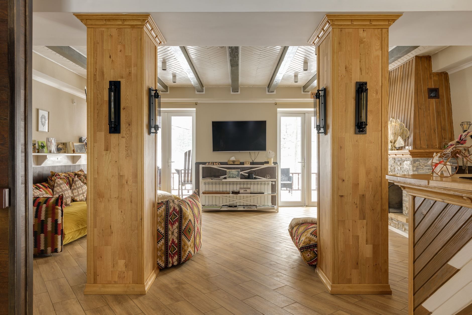 A warm modern living room featuring wooden accents, natural light, and inviting decor.